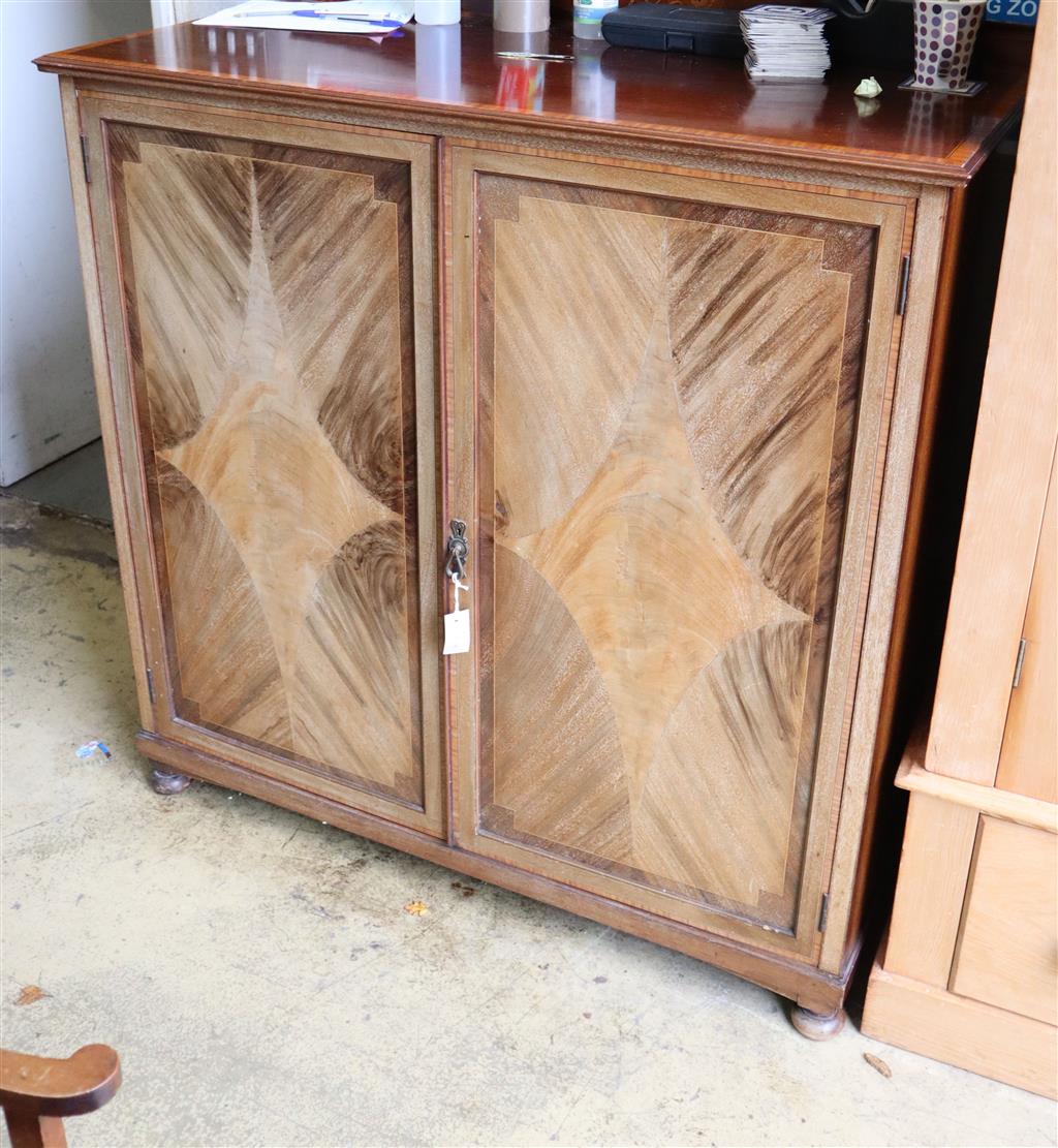 An Edwardian banded and inlaid mahogany two door cupboard, width 122cm, depth 59cm, height 130cm